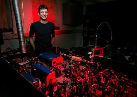 A professor standing in the laser lab